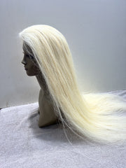 Mannequin head with long blonde wig on a white background